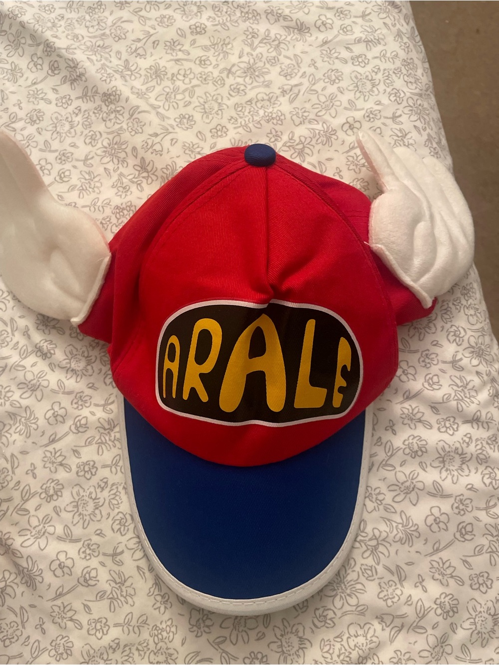 Ara Red and Blue Character Hat with White Wing Accents